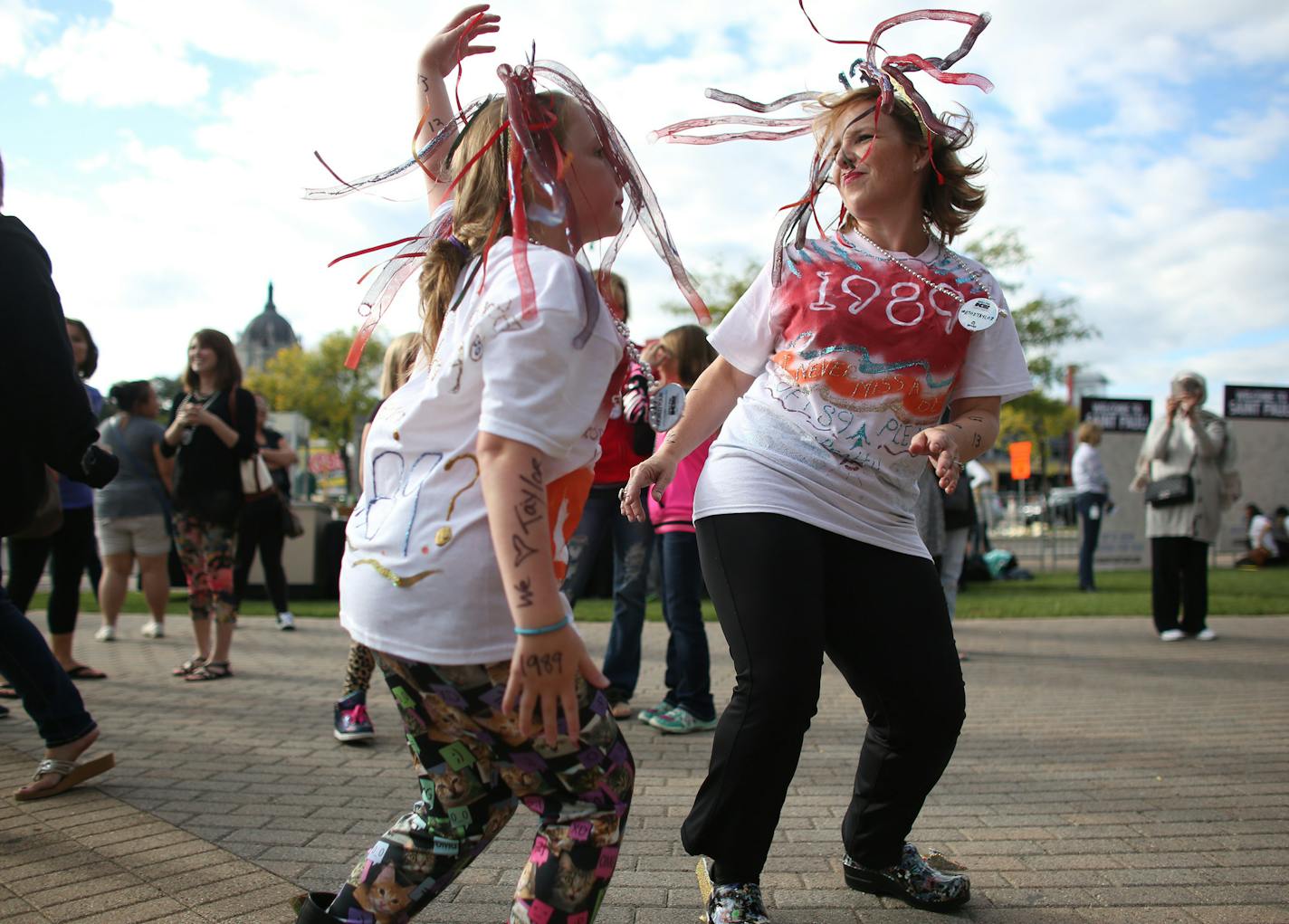 Lisa Kennedy and her daughter Maylin, 10, of Stillwater danced up a storm during the DJ Dance party that was a part of the Taylor Swift Weekend Kick-off Party. ] (KYNDELL HARKNESS/STAR TRIBUNE) kyndell.harkness@startribune.com Taylor Swift concert at the Xcel Energy Center in St. Paul, Min., Friday September 11, 2015.