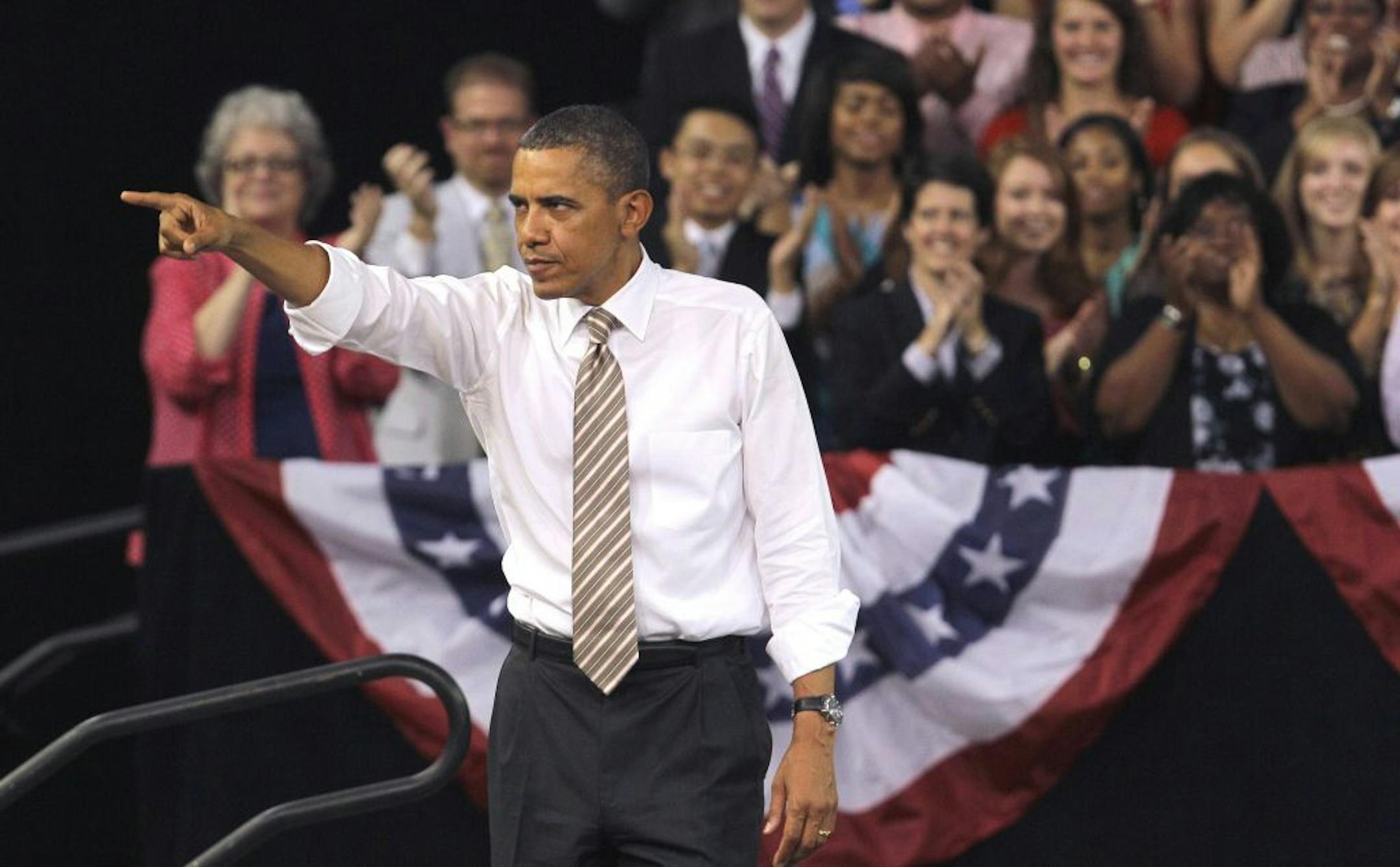 President Barack Obama points to the crowd following his speech at North Carolina State University in Raleigh, N.C., Wednesday, Sept. 14, 2011, where he spoke about the American Jobs Act.