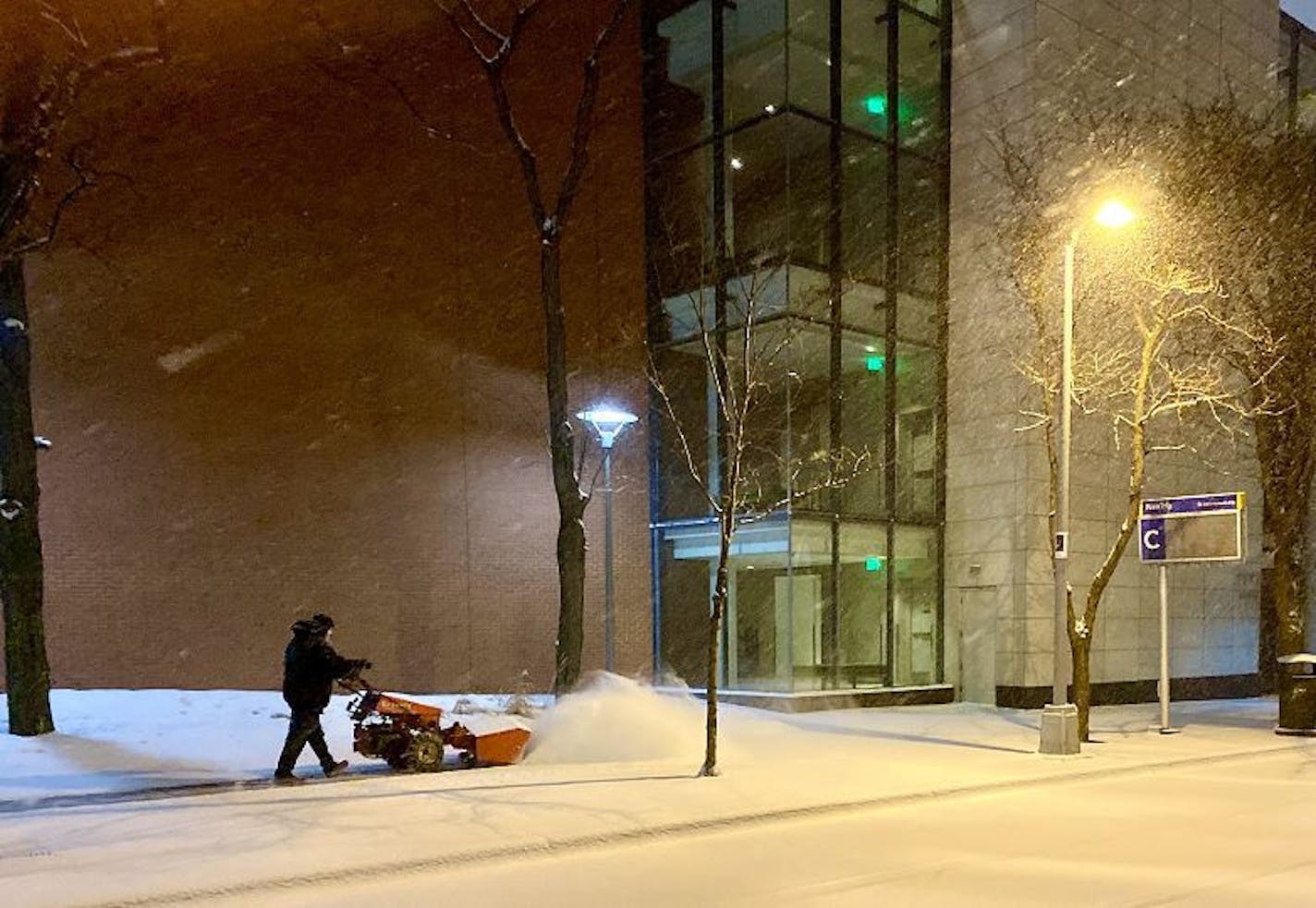 A white coating of snow Sunday in downtown Minneapolis coated what had fallen earlier and taken on a grayish-black hue. Credit: Paul Walsh/Star Tribune