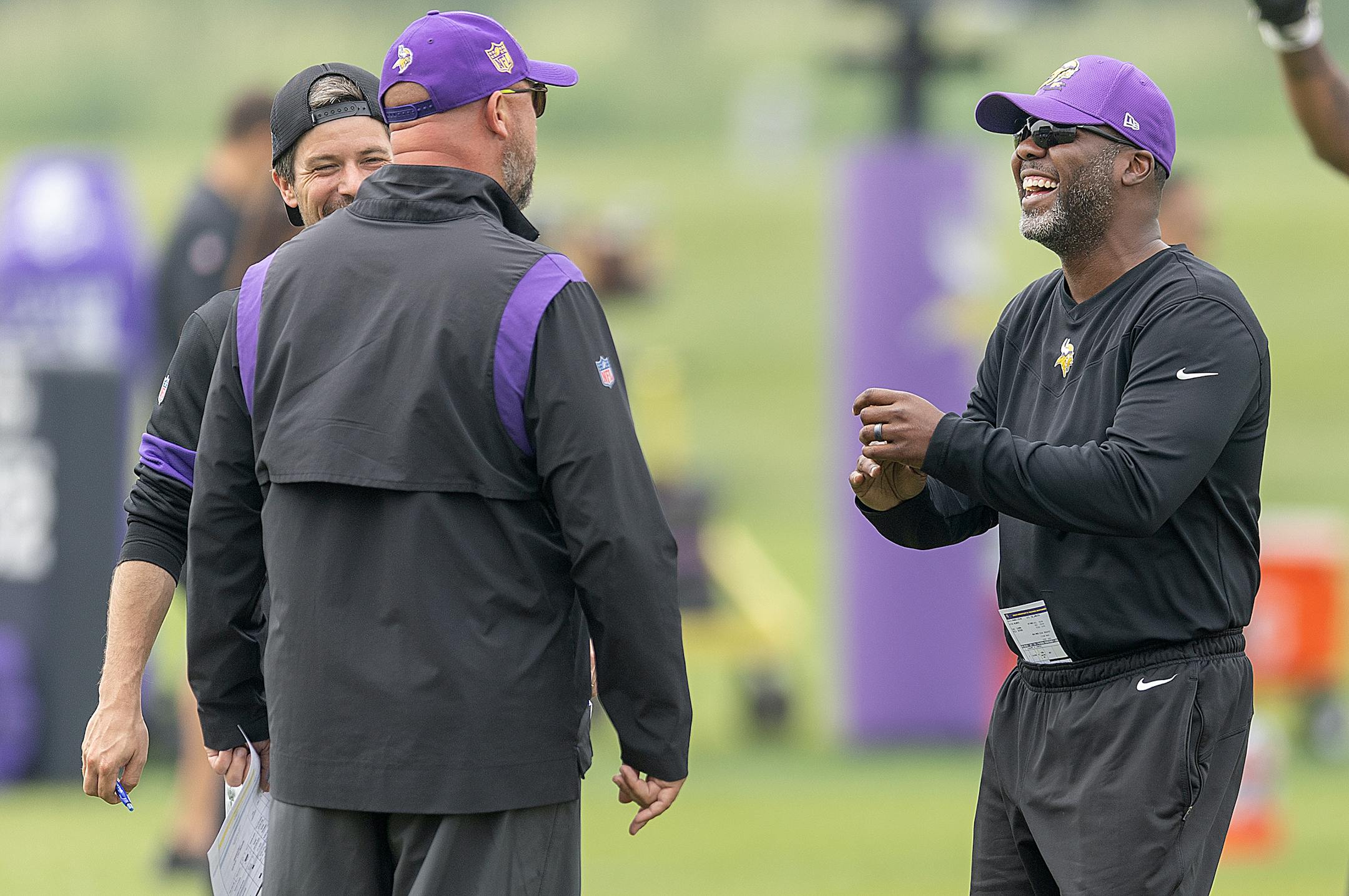 Vikings defensive backs coach Daronte Jones shares a laugh with other coaches during practice at the TCO Performance Center in Eagan, Minn., on Tuesday, June 6, 2023.