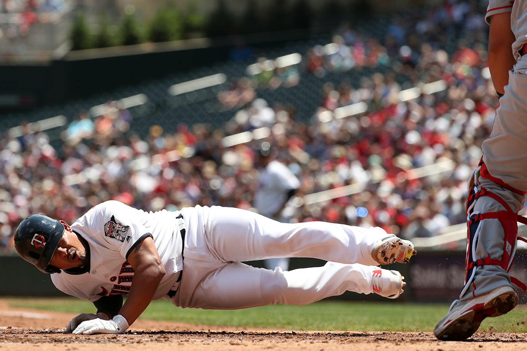 Minnesota Twins third baseman Eduardo Escobar (5) went down after he was hit by a pitch in the second inning.