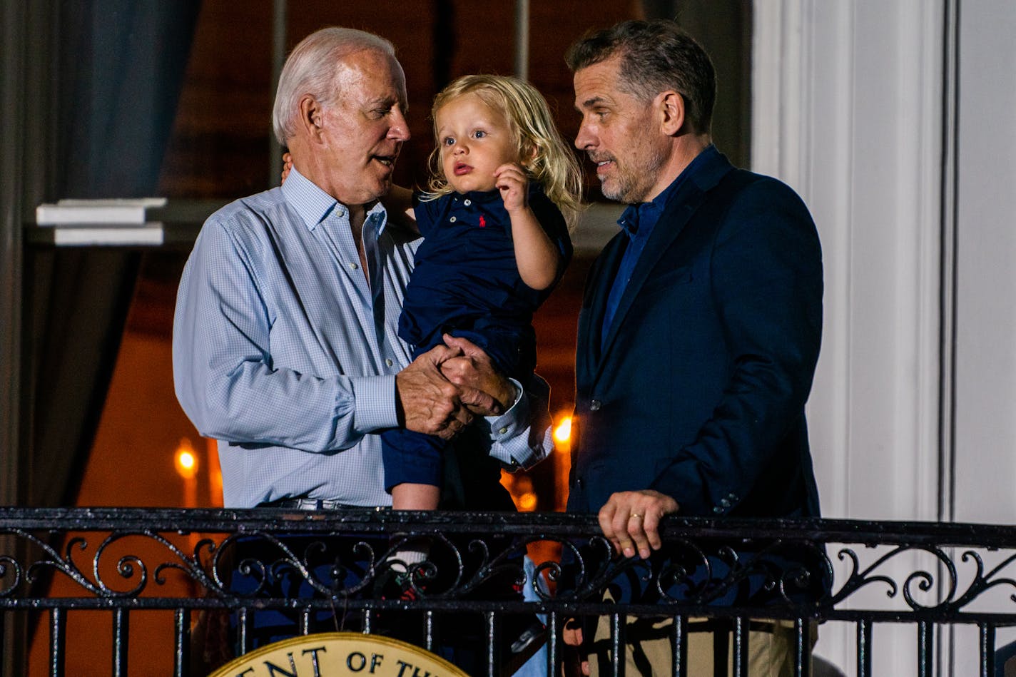 President Joe Biden holds his grandson Beau Biden with his son Hunter Biden during the Fourth of July celebration at the White House, Monday, July 4, 2022. MUST CREDIT: Washington Post photo by Demetrius Freeman.