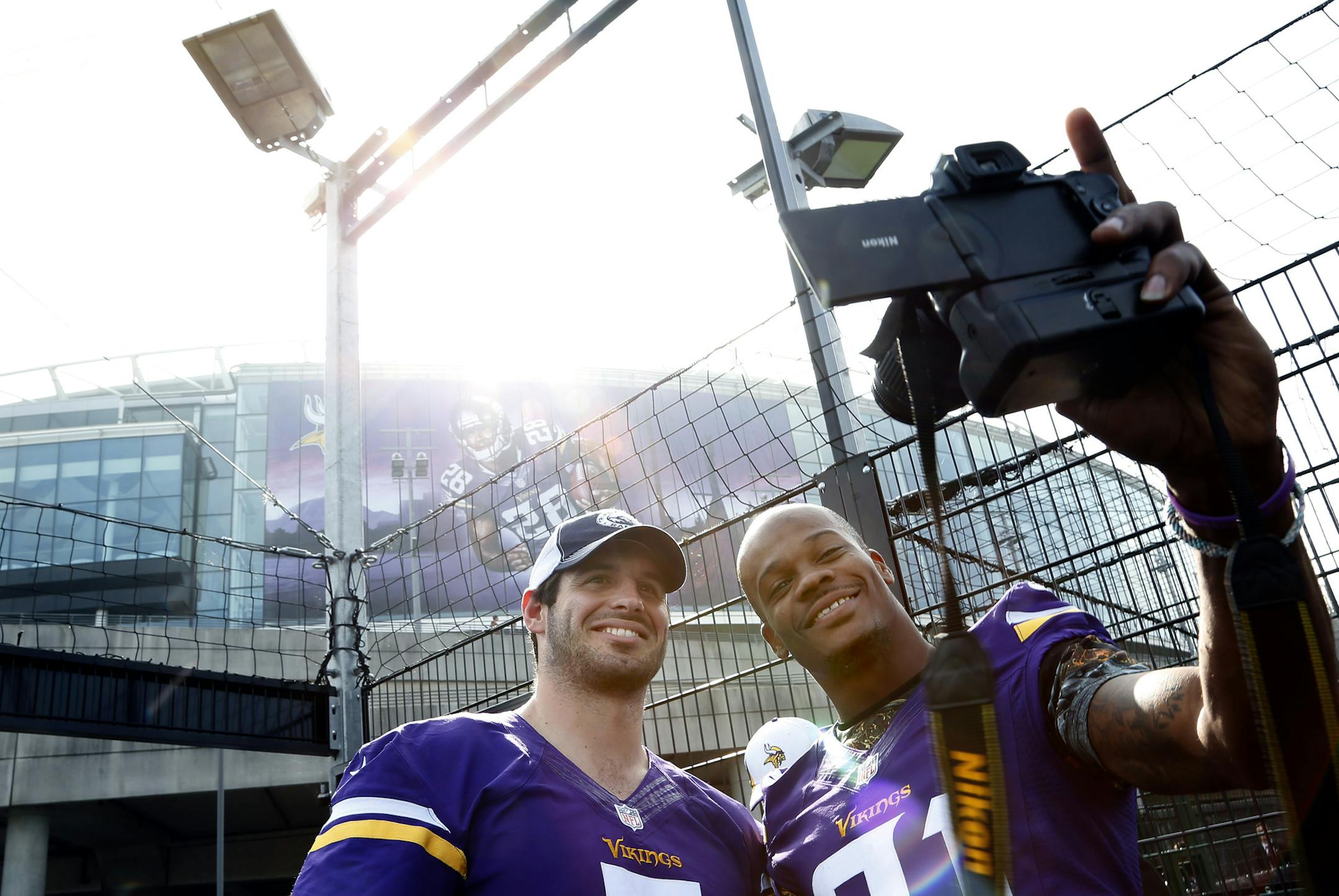 Vikings receiver Jerome Simpson, right, paused for a selfie with quarterback Christian Ponder outside London’s Wembley Stadium.