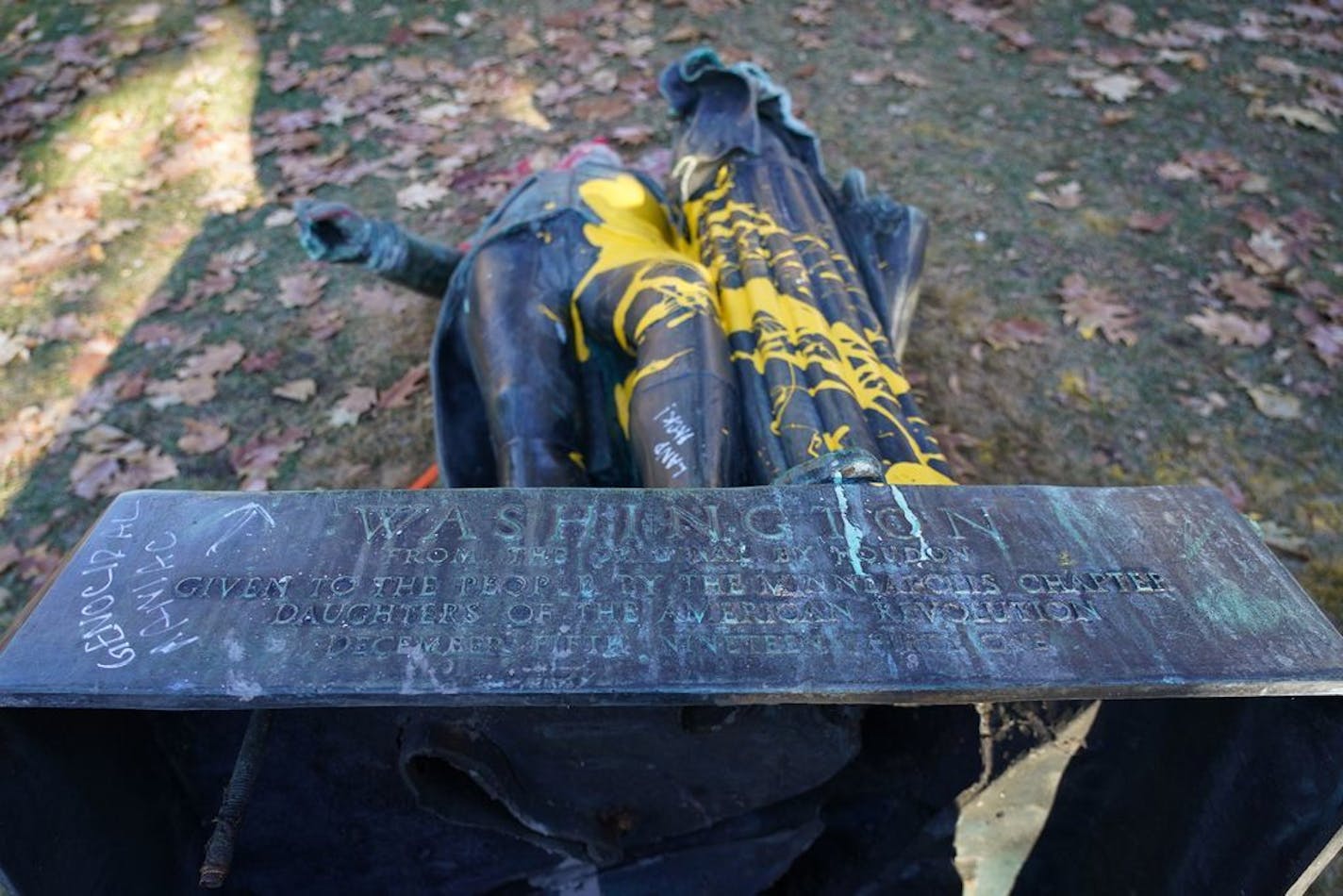 Minneapolis Park Police are investigating after vandals toppled a statue of George Washington in Washburn Fair Oaks. In this photo, "genocidal maniac" spray painted near Washington's name can be seen.