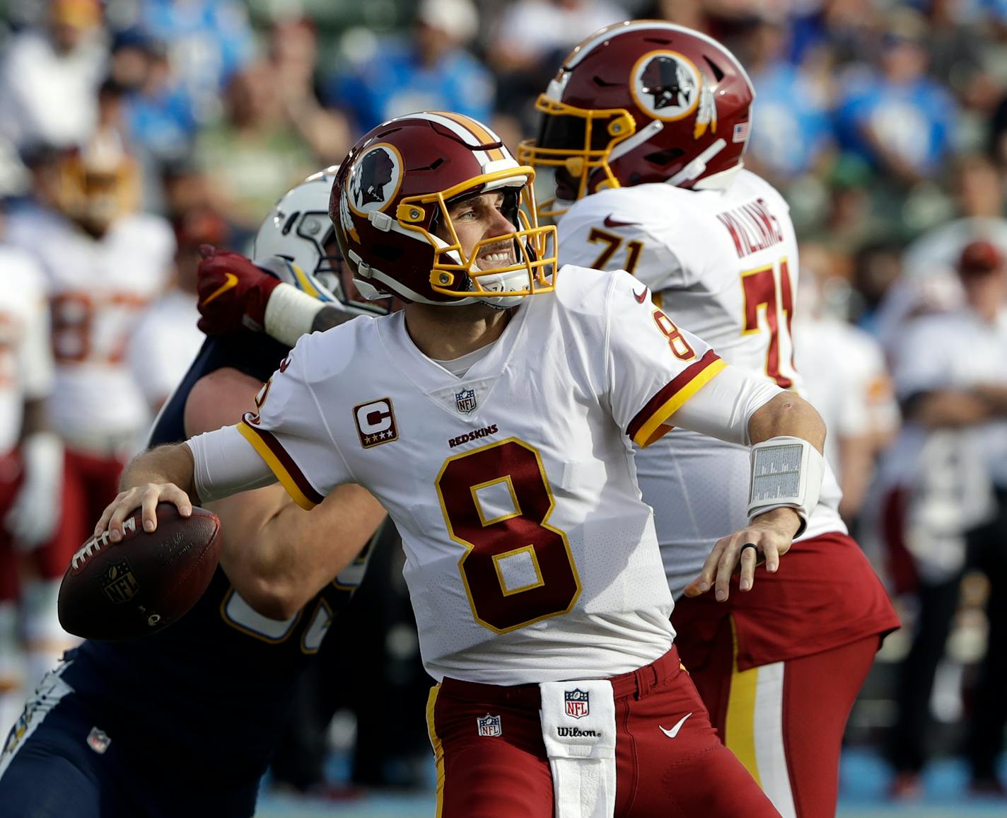 Washington Redskins quarterback Kirk Cousins passes the ball against the Los Angeles Chargers during the first half of an NFL football game Sunday, Dec. 10, 2017, in Carson, Calif. (AP Photo/Alex Gallardo)