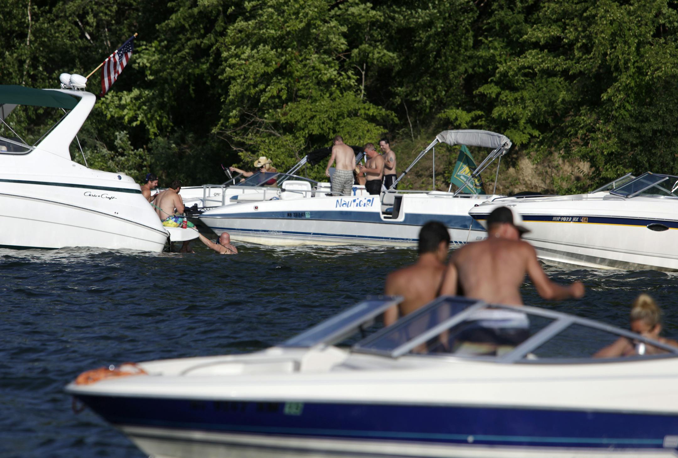 Boaters and swimmers at Cruiser Bay at Big Island in Lake Minnetonka, MN on July 19, 2013. ] JOELKOYAMA&#x201a;&#xc4;&#xa2;joel koyama@startribune Three cases of E. coli have been found in swimmers at Big Island in Lake Minnetonka, and the state health department has issued its seasonal warning to swimmers. One person was hospitalized but all have recovered. We're checking to see if any beaches have been closed. Bacterial outbreaks like this become pretty common in the summer, as water temperatu