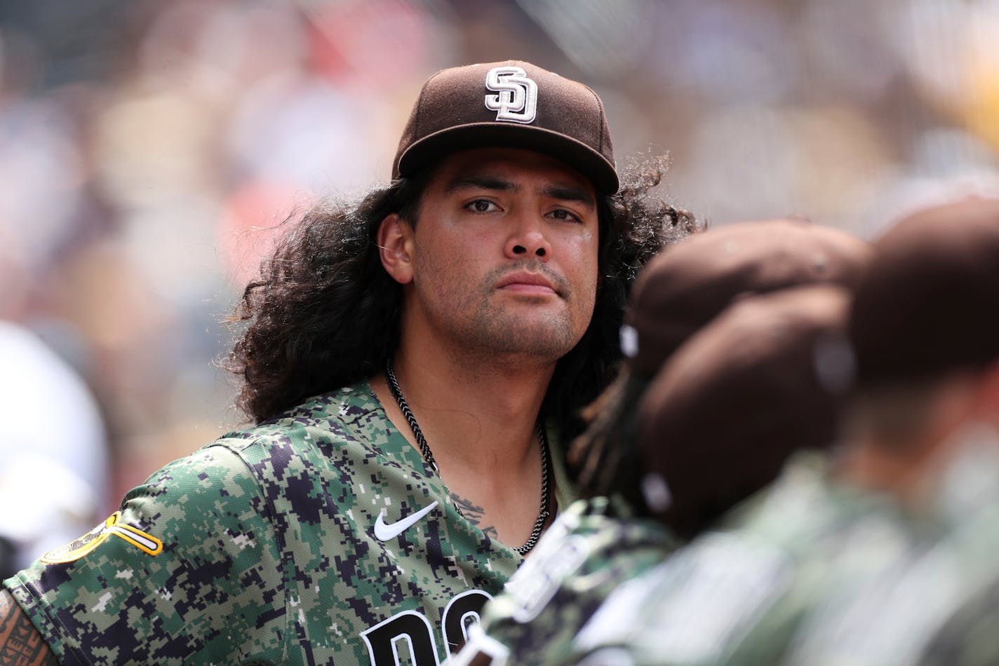 San Diego Padres' Sean Manaea looks out from the dugout in the sixth inning of a baseball game against the Minnesota Twins, Sunday, July 31, 2022, in San Diego. (AP Photo/Derrick Tuskan)