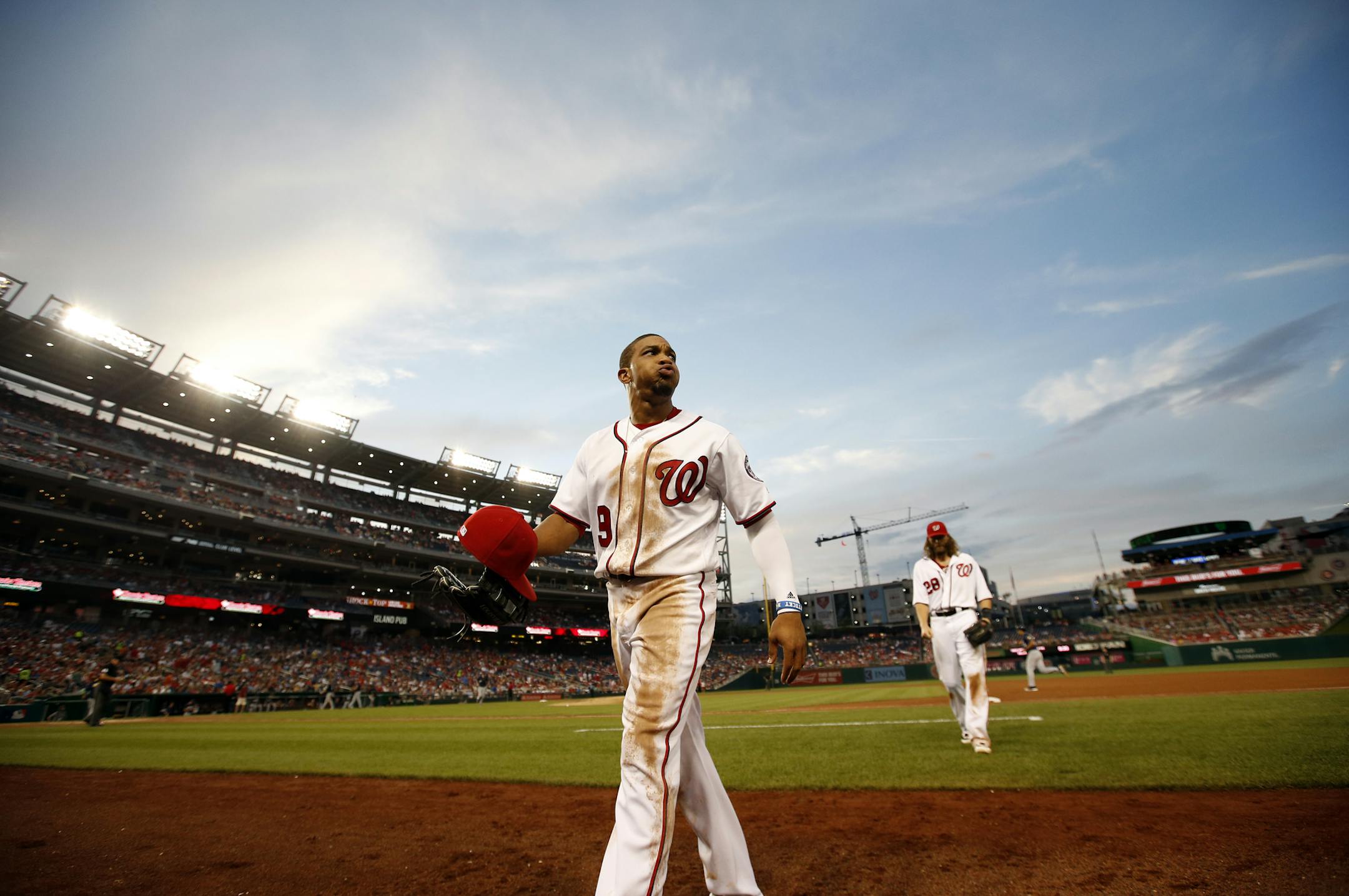Washington Nationals center fielder Ben Revere (9) heads to the dugout during a baseball game against the Milwaukee Brewers at Nationals Park, Tuesday, July 5, 2016, in Washington. (AP Photo/Alex Brandon)