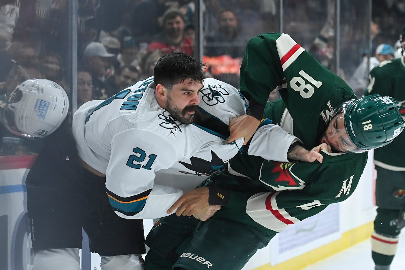 San Jose Sharks defenseman Jacob Middleton (21) tangled with Wild left wing Jordan Greenway on Nov. 16, 2021, at the Xcel Energy Center.