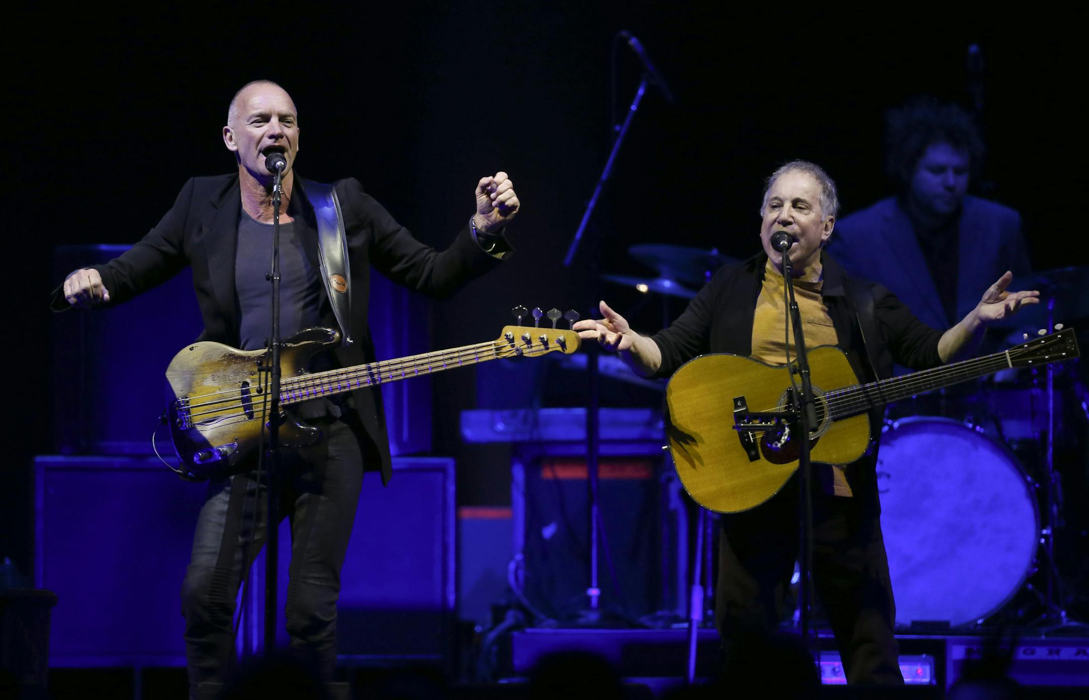 Sting, left, and Paul Simon performed at the Xcel Energy Center in St. Paul on Feb. 23, 2014.