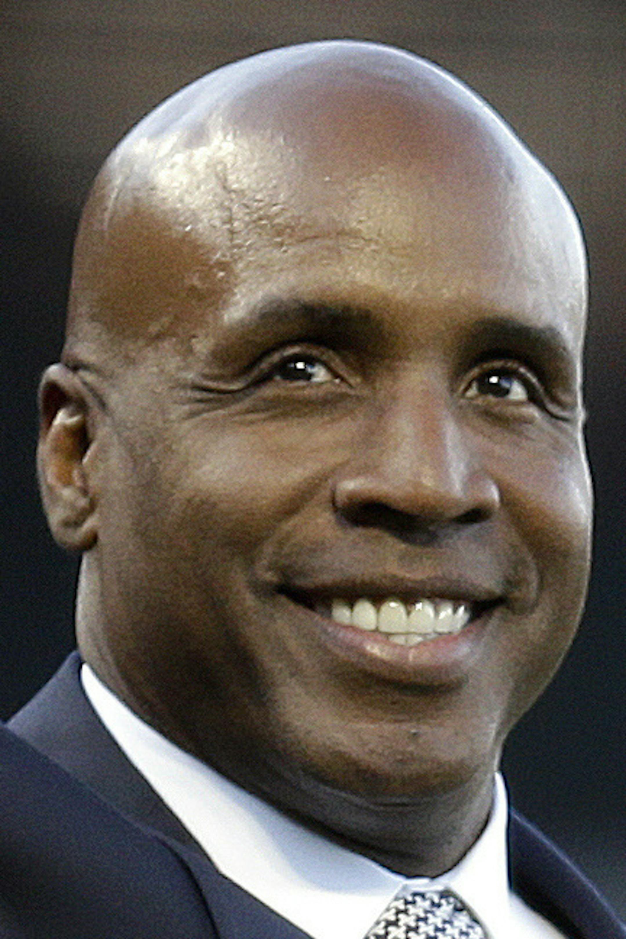 In this file photo from Saturday, July 8, 2017, former San Francisco Giants baseball player Barry Bonds waves to fans before throwing the ceremonial first pitch prior to the Giants' baseball game against the Miami Marlins in San Francisco. Home run king Barry Bonds will have his No. 25 jersey retired this August by the San Francisco Giants when his former Pittsburgh Pirates are in town. The Giants announced Tuesday, Feb. 6, 2018, they would hold a ceremony to honor the former slugger and seven-t