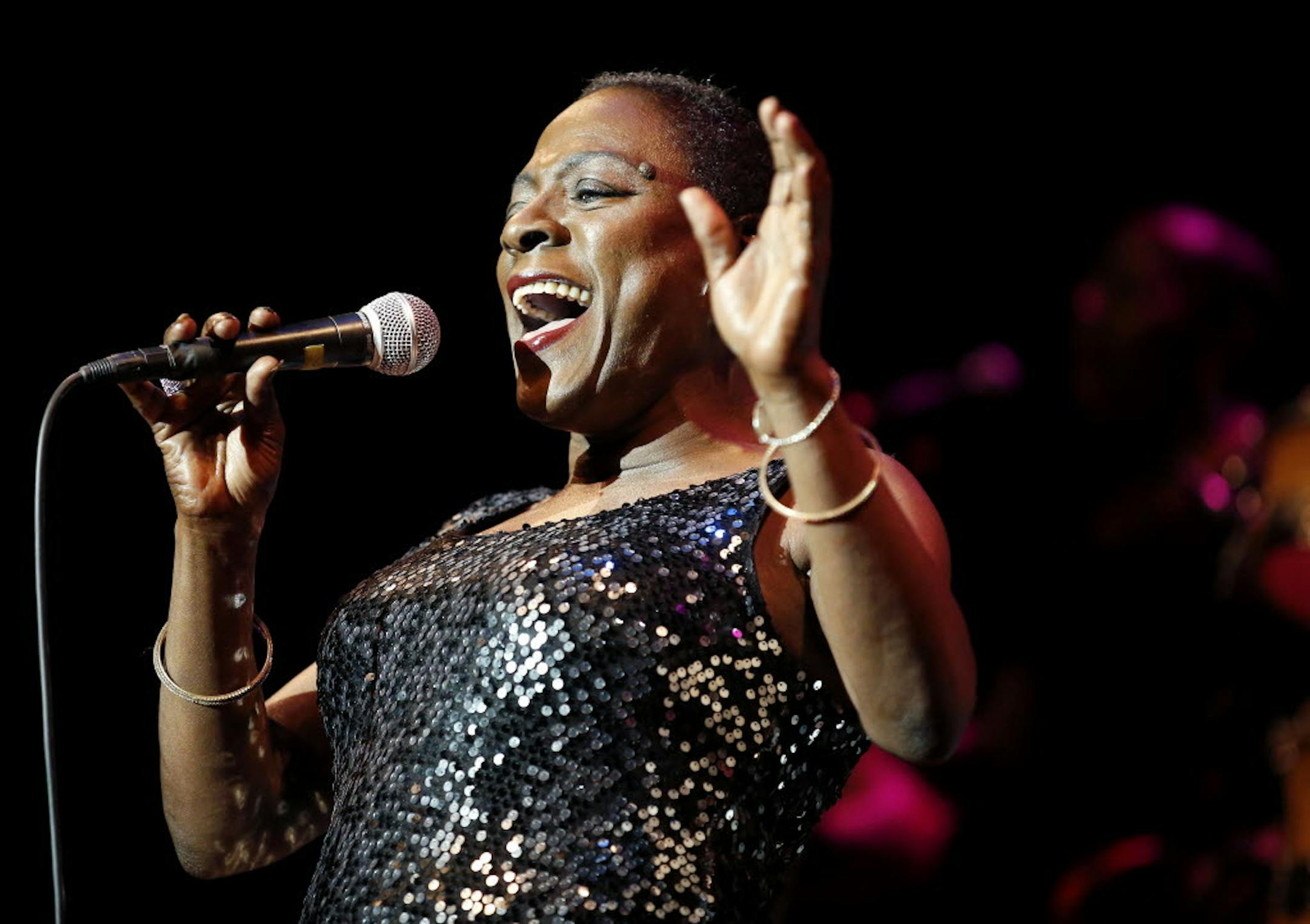 Sharon Jones, shown in a 2014 performance at the State Theatre in Minneapolis, has died at age 60.