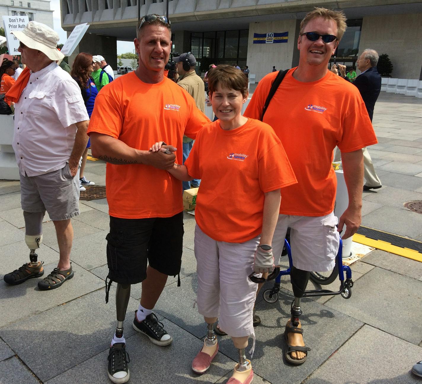 From left, amputees Scott Bonebrake, Ann Morris and Scott Tjaden, travelled from Minnesota to protest newly proposed Medicare payment rules for prosthetics.