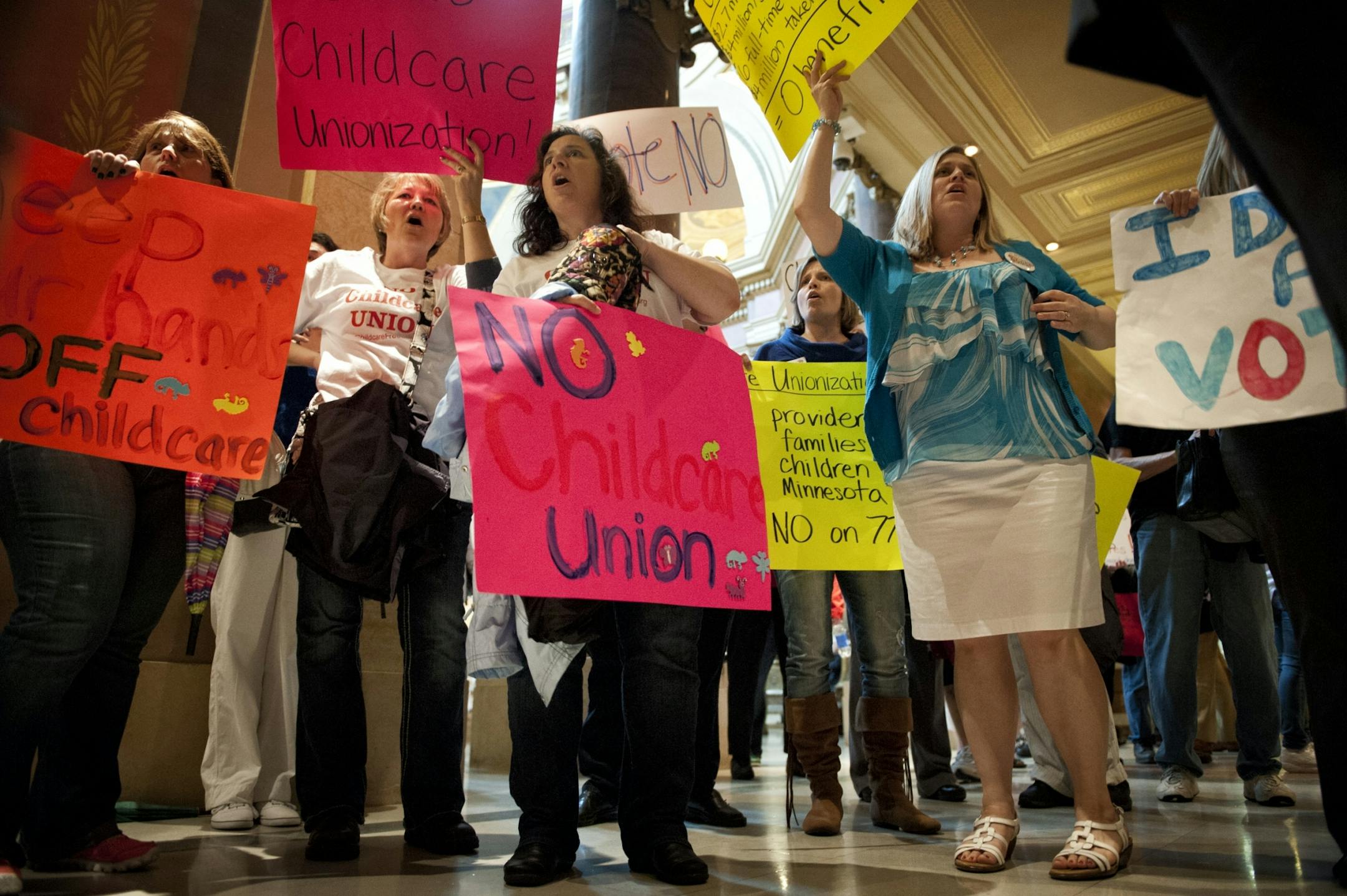 Daycare providers cheering Vote No outside the House Chamber. Vote Yes and Vote No echoed in throughout the Capitol Saturday, May 18, 2013 as legislators were set to debate the childcare unionization bill.