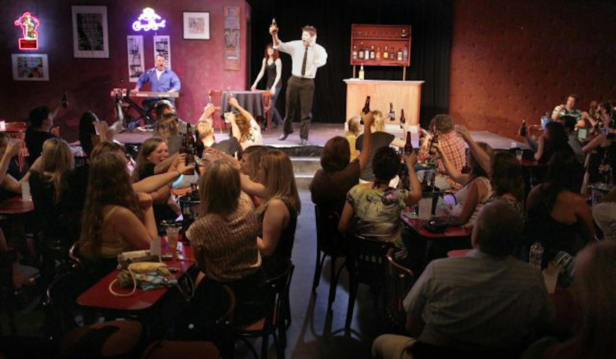 Bartender/actor Mike Rylander works the crowd. This was one of several toasts through the night.