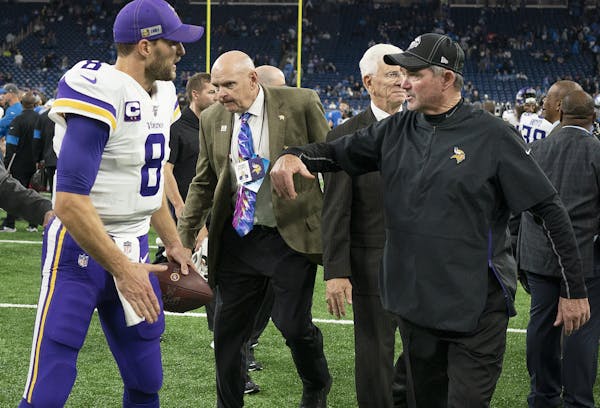 Minnesota Vikings head coach Mike Zimmer celebrated their win with Minnesota Vikings quarterback Kirk Cousins (8) at Ford Field.] Jerry Holt &#x2022; 