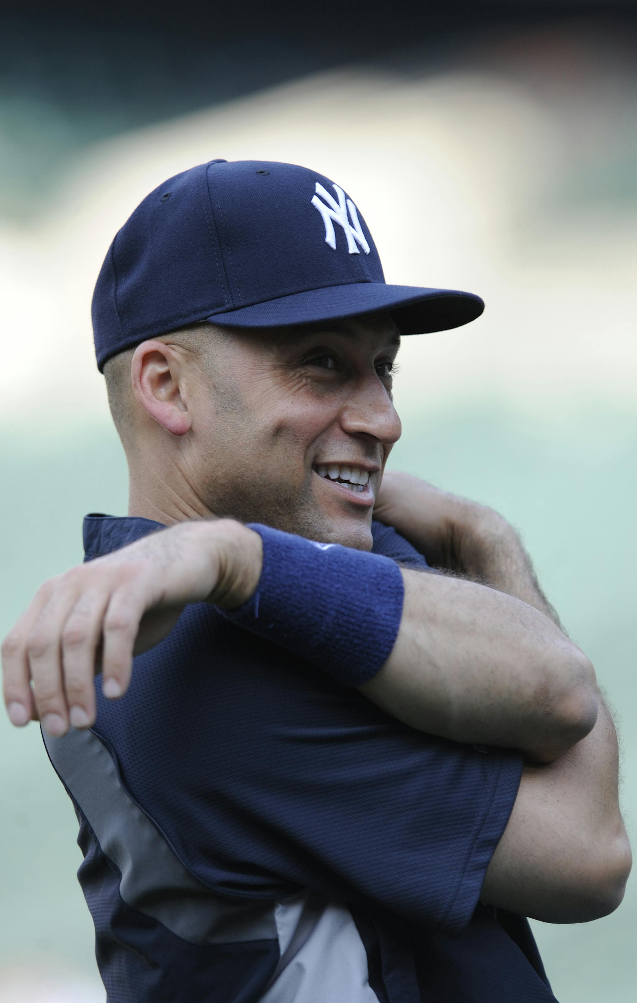 New York Yankees' Derek Jeter warms up before playing the Baltimore Orioles in a baseball game, Sunday, July 13, 2014, in Baltimore.(AP Photo/Gail Burton)