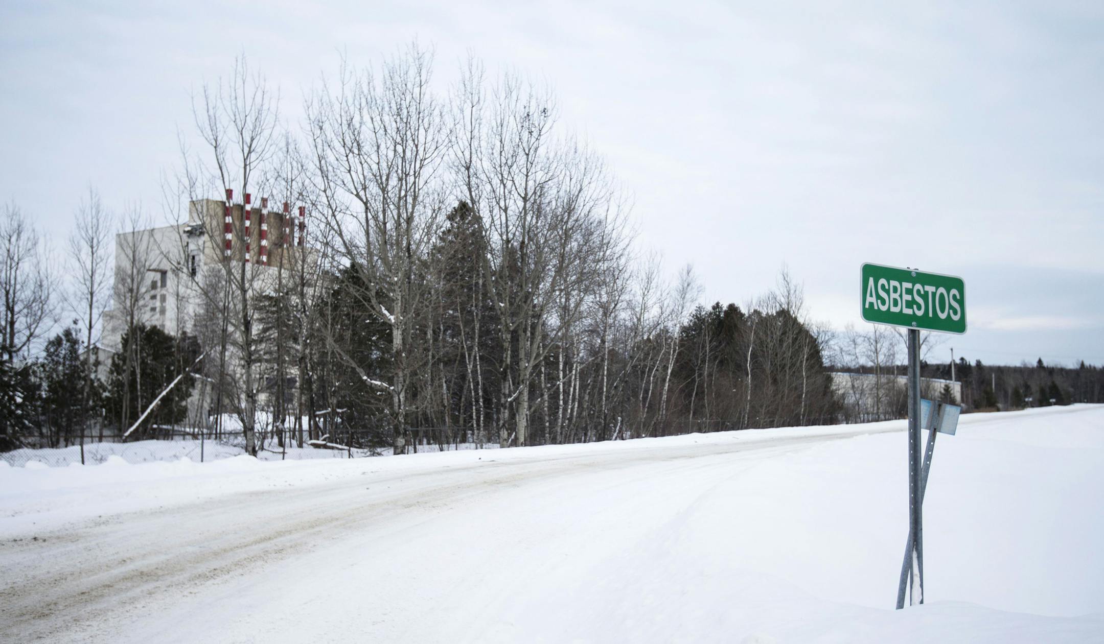 A sign designating the town line stands in Asbestos, Quebec, on Feb. 9, 2018. MUST CREDIT: Bloomberg photo by Christinne Muschi.
