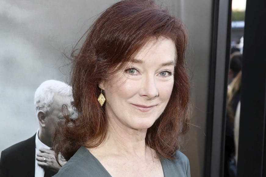 Actress Valerie Mahaffey closeup wearing green dress with V neckline
