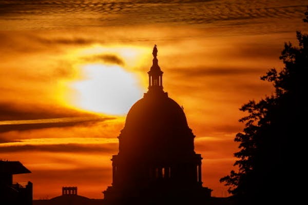 In this Oct. 26, 2018, file photo the rising sun silhouettes the U.S. Capitol dome at daybreak in Washington. The Treasury Department said Tuesday tha