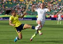 United States' Lauren Holiday (12) and Colombia's Orianica Velasquez (9) chase the ball during first half FIFA Women's World Cup round of 16 soccer ac