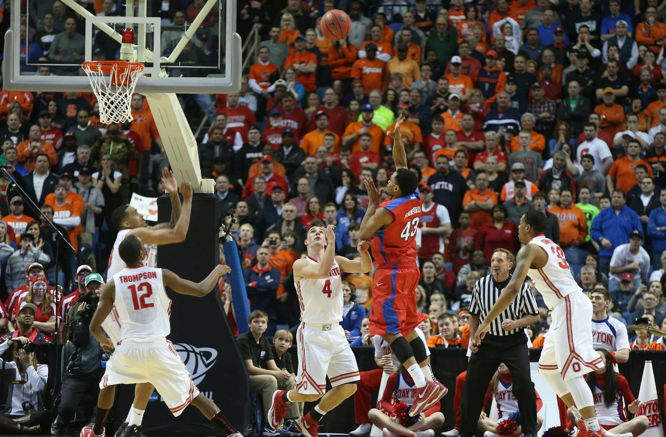Dayton's Vee Sanford (43) hits the game-winning shot against Ohio State 3.8 seconds remaining in the second half in a second-round game of the NCAA college basketball tournament in Buffalo, N.Y., Thursday, March 20, 2014. (AP Photo/The Buffalo News, Robert Kirkham) TV OUT; MAGS OUT; MANDATORY CREDIT; BATAVIA DAILY NEWS OUT; DUNKIRK OBSERVER OUT; JAMESTOWN POST-JOURNAL OUT; LOCKPORT UNION-SUN JOURNAL OUT; NIAGARA GAZETTE OUT; OLEAN TIMES-HERALD OUT; SALAMANCA PRESS OUT; TONAWANDA NEWS OUT