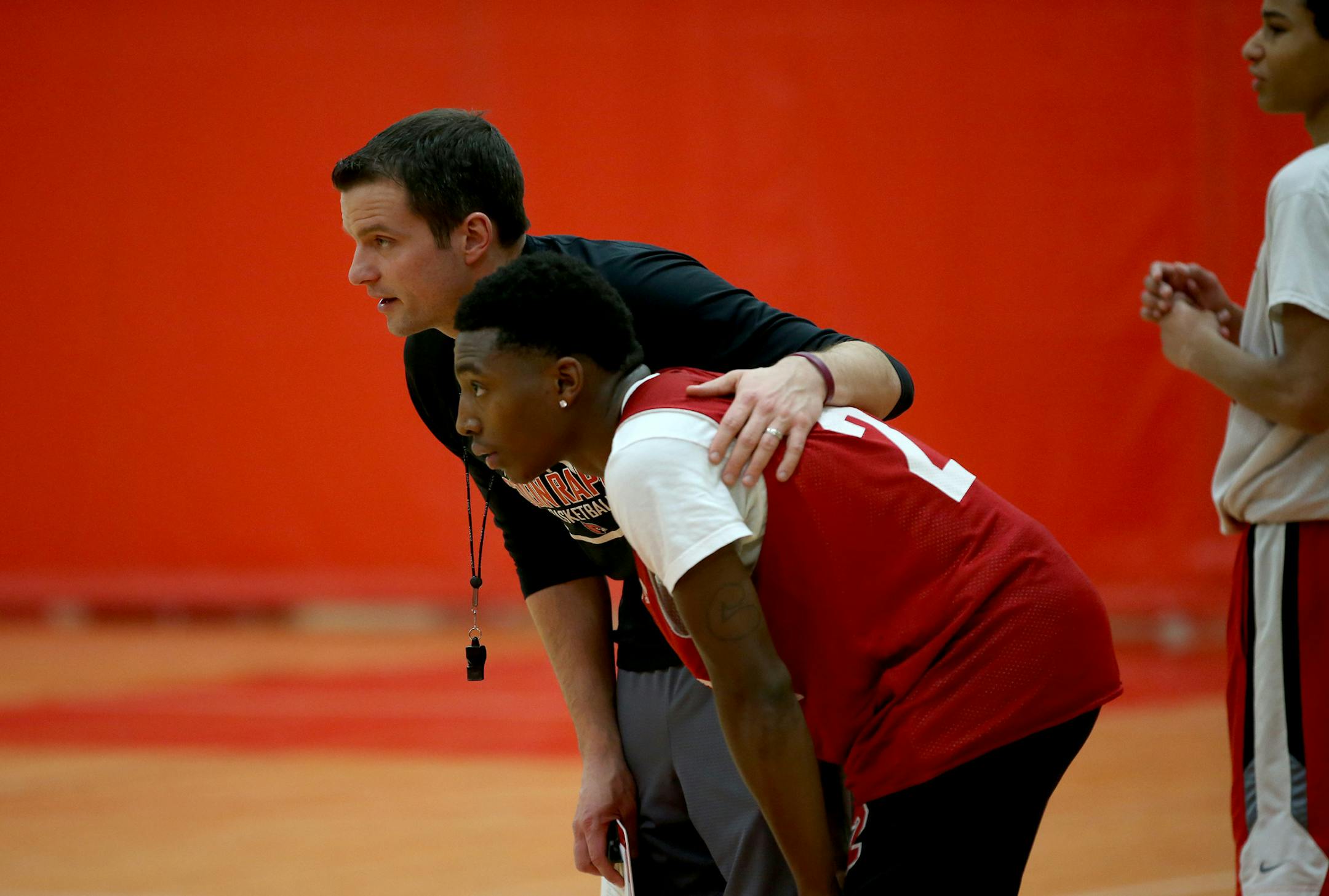 Coon Rapids basketball player Chris Buckley talked with his coach Mike Ogorek. ] (KYNDELL HARKNESS/STAR TRIBUNE) kyndell.harkness@startribune.com During practice in Coon Rapids , Min., Thursday, December 4, 2014.
