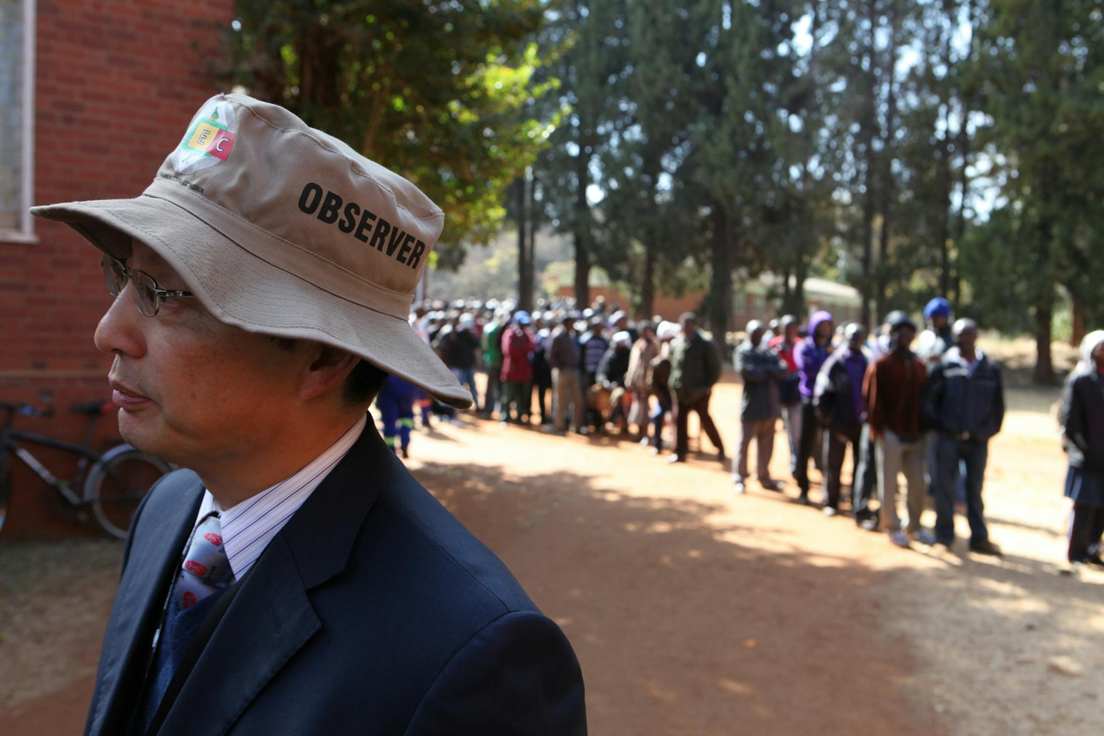 An election observer looks on during Presidential and parliamentary elections in Harare, Wednesday, July, 31, 2013. Zimbabwe's President Robert Mugabe, 89, is contesting against his main rival Morgan Tsvangirai in the presidential poll.(AP Photo/Tsvangirayi Mukwazhi