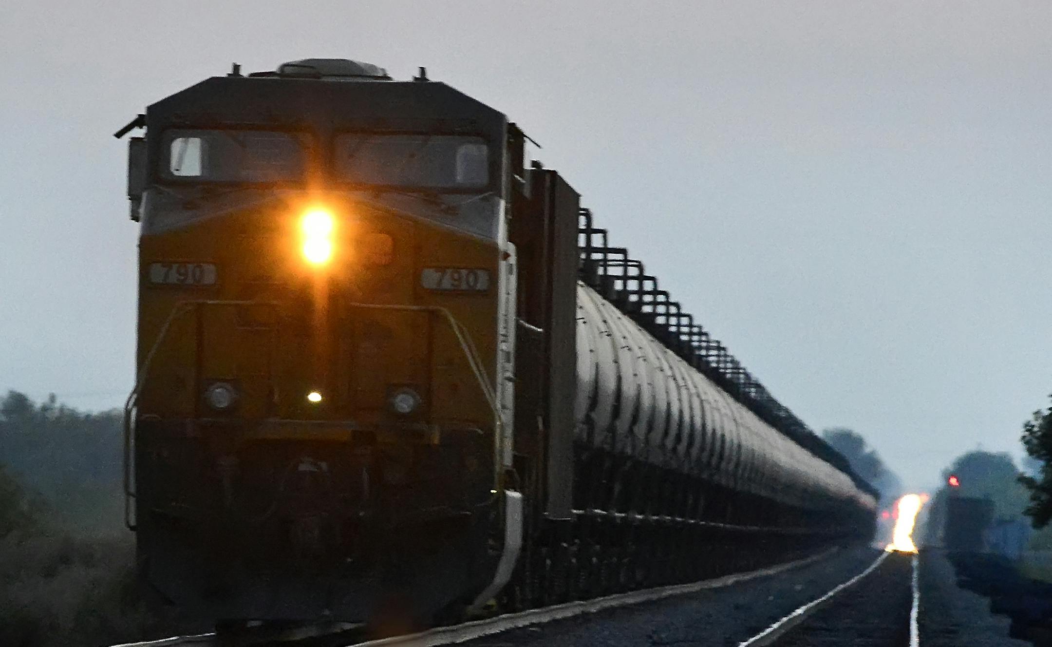 FILE -- A Burlington Northern Santa Fe oil train outside Casselton, N.D., Aug. 4, 2014. An energy boom that has created a sharp increase in rail freight traffic nationwide is causing major delays for Amtrak passenger trains and is holding up the transport of vital consumer and industrial goods, including chemicals, coal and hundreds of thousands of new American cars, rail officials and federal and state regulators say. (Dan Koeck/The New York Times)