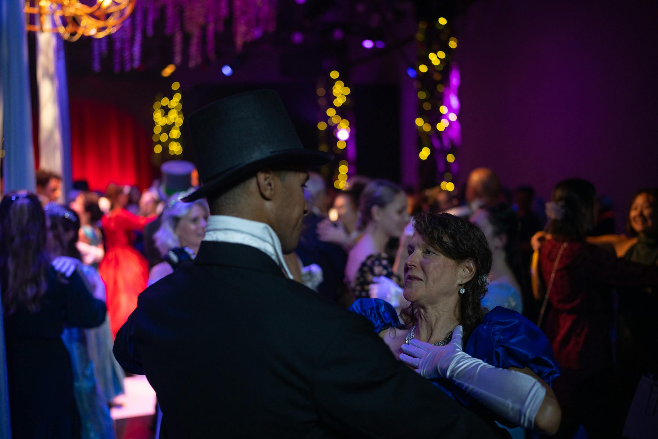 A cast member danced with an audience member on opening night of The Queen's Ball: A Bridgerton Experience.