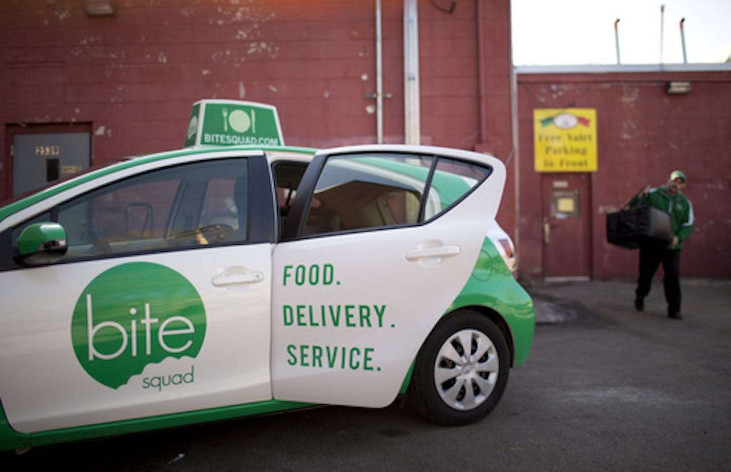 Restaurants are now outsourcing one of their onerous tasks, delivery. With food as a primary focus, restaurants can leave the delivery to a 3rd party. At least six delivery services have sprung up in the Twin Cities in the past year. Sean Dolan, a delivery driver for one of the new ones, Bite Squad, carried the food out to his vehicle that he was picking up at Pancho Villa's Bar & Grill on Eat Street in Minneapolis Thursday afternoon, April 4, 2013 before running it to an office building downtow