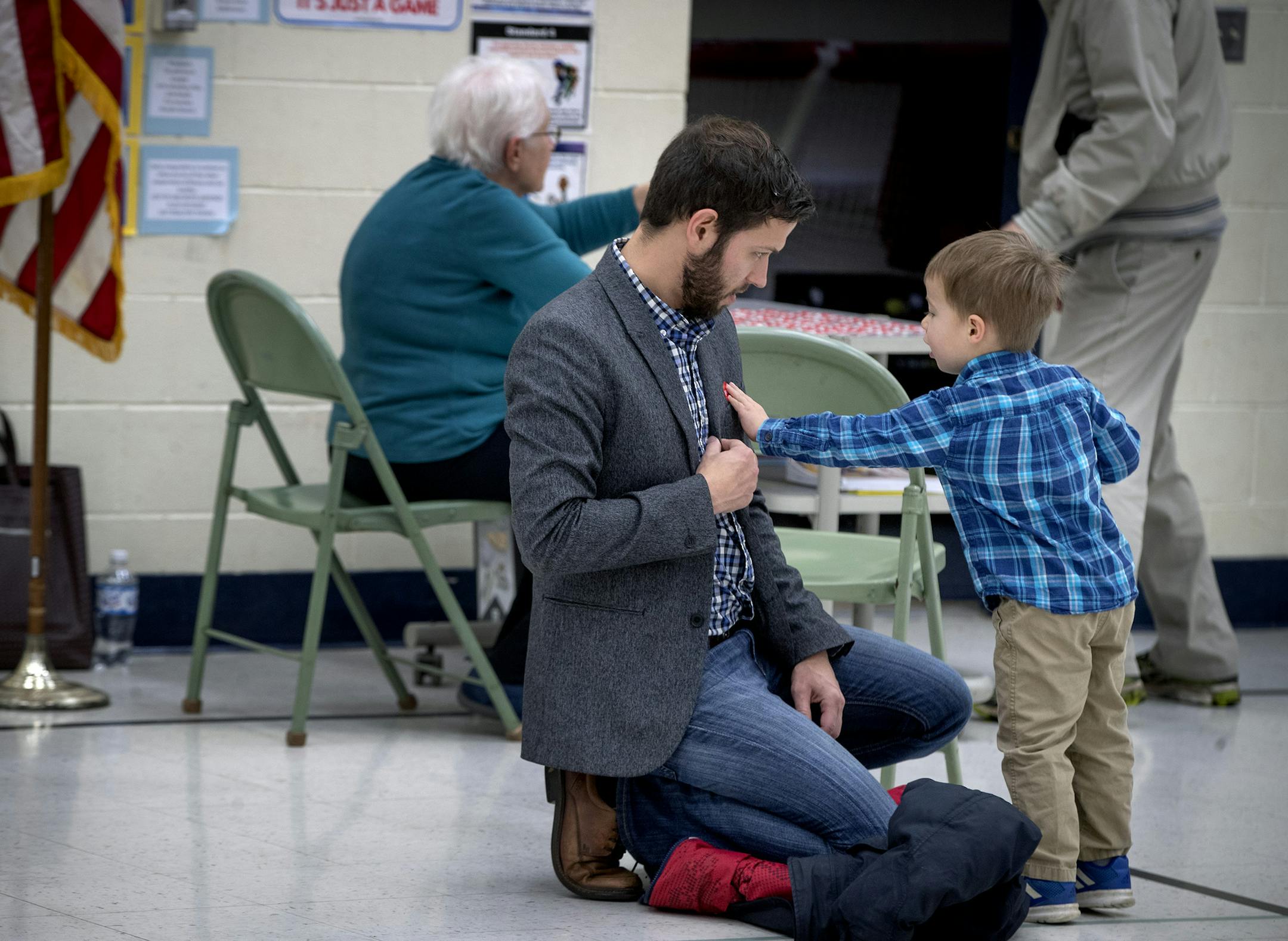 Three-year-old Josef Kuzel placed the red "I Voted" sticker on his father Bryan Kuzel after he cast his vote at Somerset Elementary School, Tuesday, November 6, 2018 in Mendota Heights.