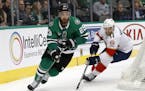 Dallas Stars defenseman Greg Pateryn (29) handles the puck in front of Florida Panthers left wing Jonathan Huberdeau (11) during an NHL hockey game, T
