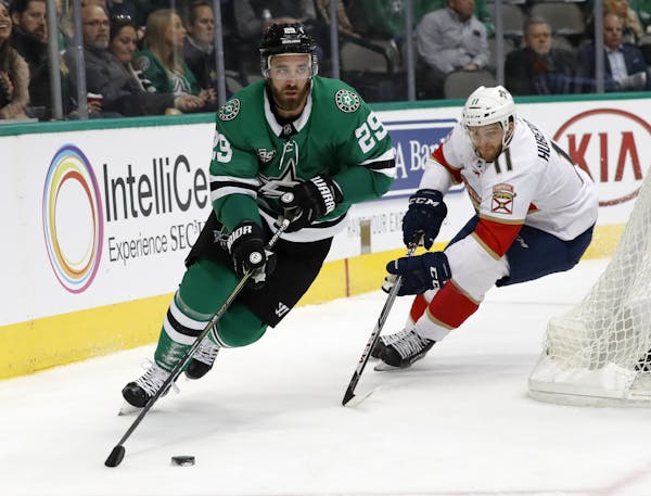 Dallas Stars defenseman Greg Pateryn (29) handles the puck in front of Florida Panthers left wing Jonathan Huberdeau (11) during an NHL hockey game, T