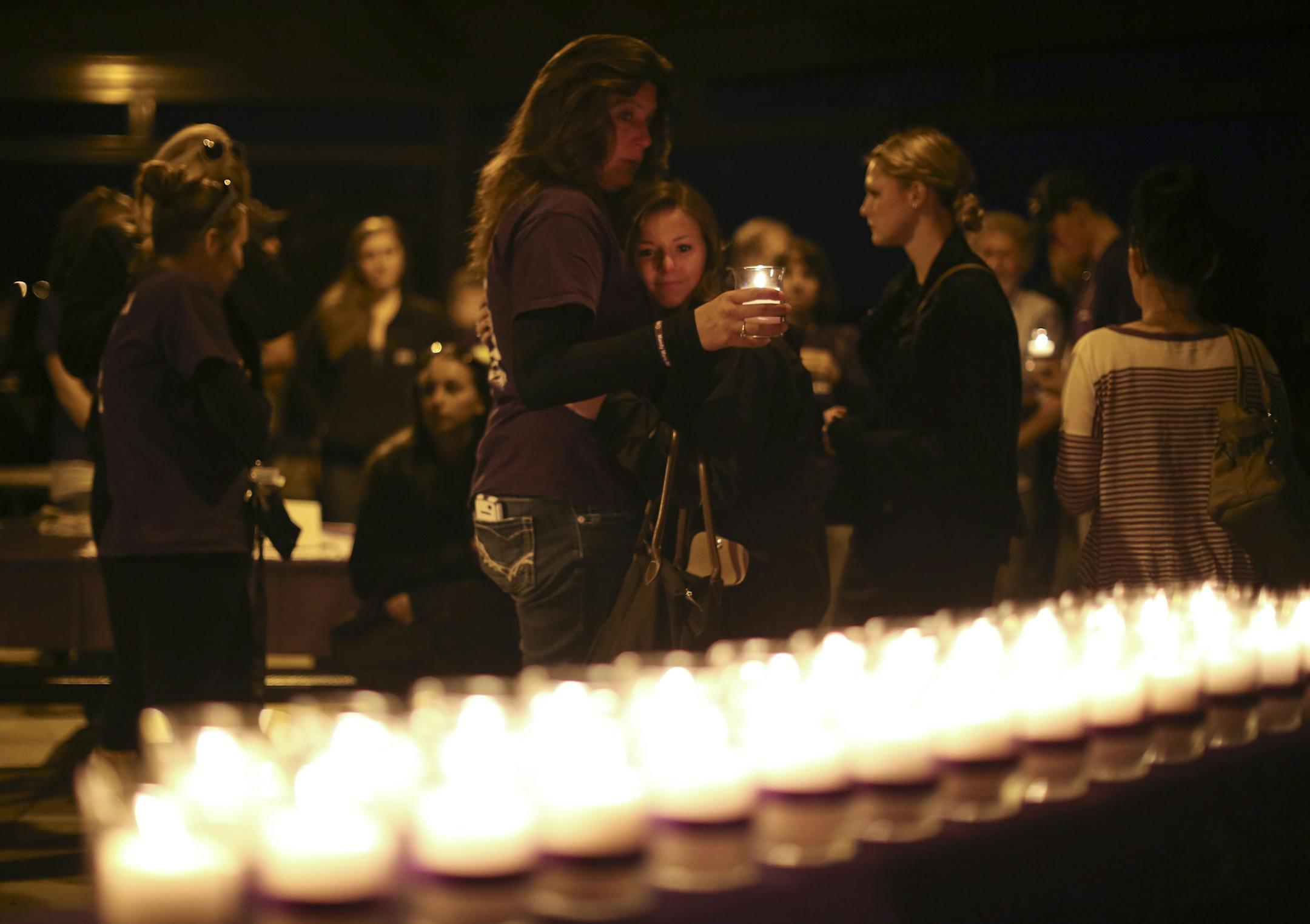 A vigil, organized by Cornerstone as part of Domestic Violence Awareness Month, was held Monday evening, October 7, 2013 at Purgatory Creek Park in Eden Prairie. Names were read and a candle was lit to honor each of the 38 deaths related to domestic violence in the state so far this year. The first name read was of Mandy Matula, 24, of Eden Prairie, who disappeared five months ago. She was last seen with her ex-boyfriend, who later killed himself. Candles for each of the victims were lit as thei