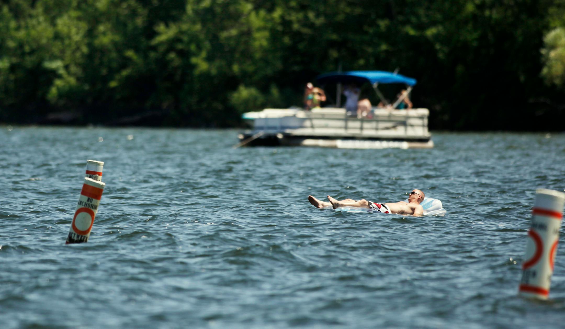 A man floats in Cruiser Bay at Big Island in Lake Minnetonka, MN on July 19, 2013. ] JOELKOYAMA‚Ä¢joel koyama@startribune Three cases of E. coli have been found in swimmers at Big Island in Lake Minnetonka, and the state health department has issued its seasonal warning to swimmers. One person was hospitalized but all have recovered. We're checking to see if any beaches have been closed. Bacterial outbreaks like this become pretty common in the summer, as water temperatures rise and crud gets wa