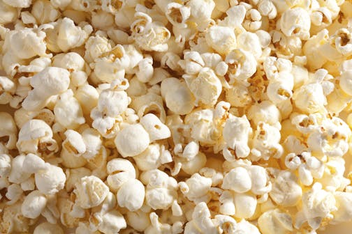 Closeup of popcorn. Some microwave popcorns contain trans fat. iStock