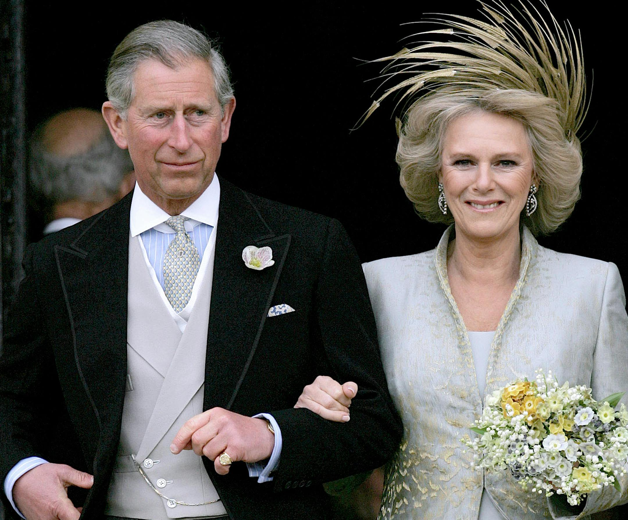 FILE - In this Saturday, April 9, 2005 file photo, Britain's Prince Charles and his bride Camilla Duchess of Cornwall leave St George's Chaple in Windsor, England following the church blessing of their civil wedding ceremony. Prince Charles is readying the paperwork to claim his pension when he turns 65 on Thursday, Nov. 14, 2013, but he still hasn't started the job he was born to do. (AP Photo/ Alastair Grant, Pool, File)
