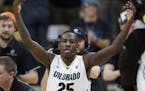 Colorado guard McKinley Wright IV celebrates as time runs out in the second half of an NCAA college basketball game against Arizona, Saturday, Jan. 6,