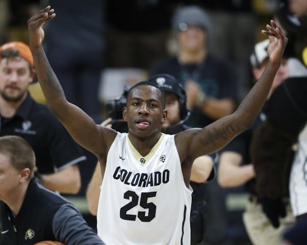 Colorado guard McKinley Wright IV celebrates as time runs out in the second half of an NCAA college basketball game against Arizona, Saturday, Jan. 6,