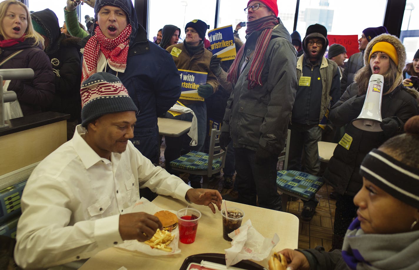 Near the Walmart near the intersection of Snelling and University in St. Paul, protesters entered a McDonald to demand living wages from the corporation. Diners Jerry Harrell and Jelahn Carter were sympathetic. Carter makes minimum wage working full time and supporting two kids as a single parent.] Richard Tsong-Taatarii/ rtsong- taatarii@startribune.com