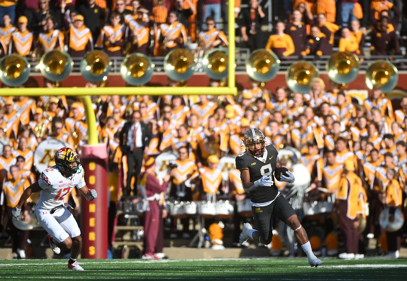 Minnesota Gophers running back Ky Thomas (8) rushes the ball for a first down during the first quarter of a football game between the University of Minnesota Gophers and the Maryland Terrapins Saturday, Oct. 23, 2021 at Huntington Bank Stadium in Minneapolis, Minn. ] AARON LAVINSKY • aaron.lavinsky@startribune.com