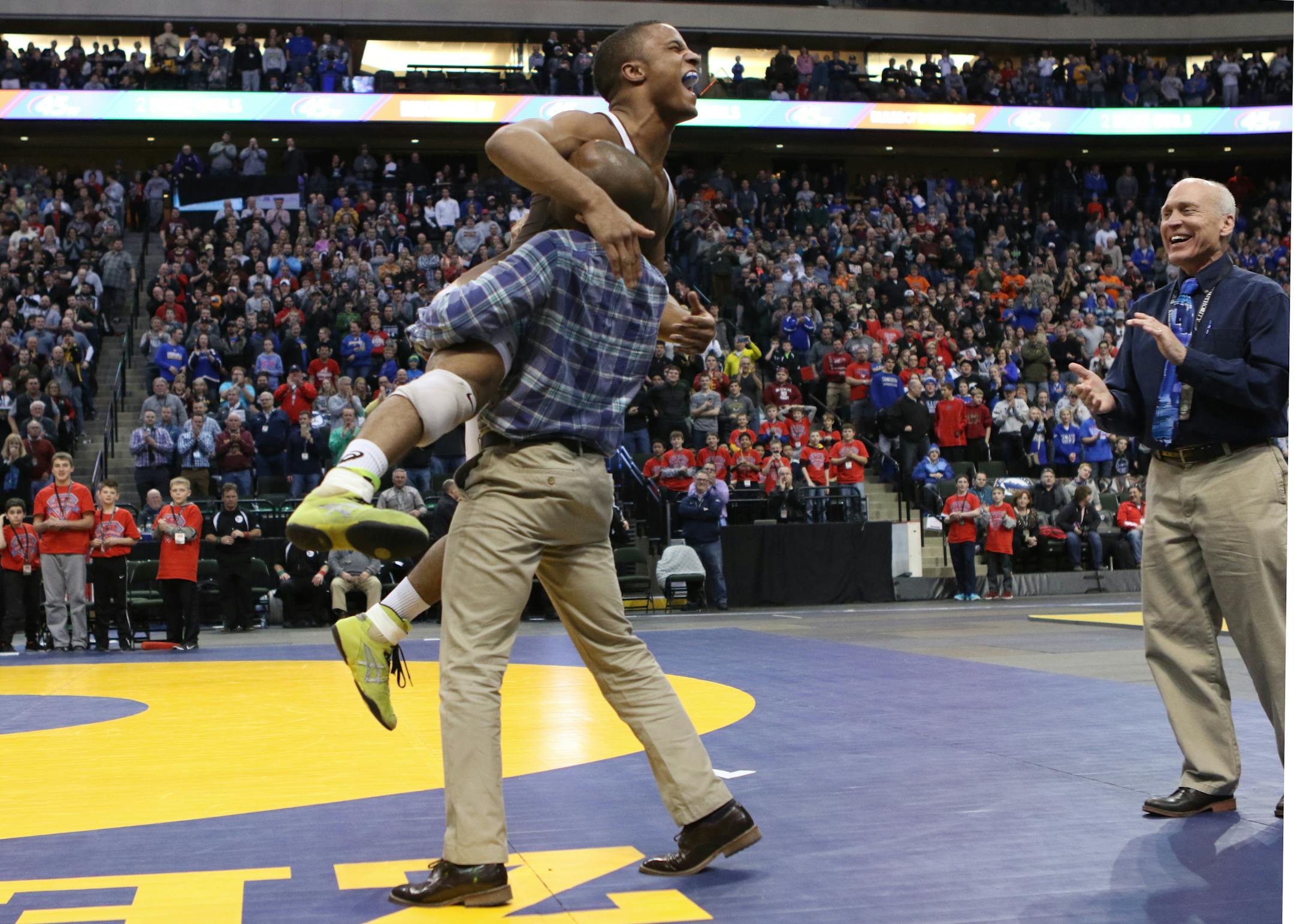 Mark Hall of Apple Valley celebrated after winning his record sixth state title on Feb. 27 at the wrestling state meet at Xcel Energy Center in St. Paul. He won in the 170-pound division.