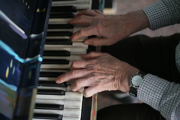 Gerald Ollila, 80, played a piano outside of the IDS Center on Wednesday. Ollila but used to play 40 years ago, but "never learned music, notes, or an