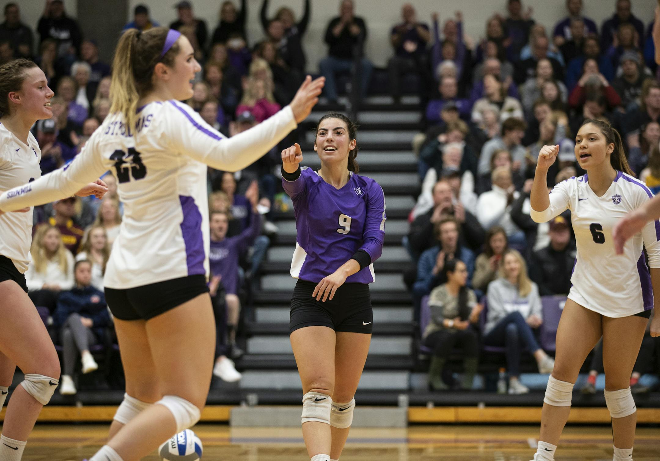 Ellie Meyer celebrates a point with teammates during the MIAC Championship volleyball game against St. Olaf in the Anderson Athletic and Recreation Center in St. Paul on November 9, 2019. St. Thomas won the game by a final score of 3 sets to 1.