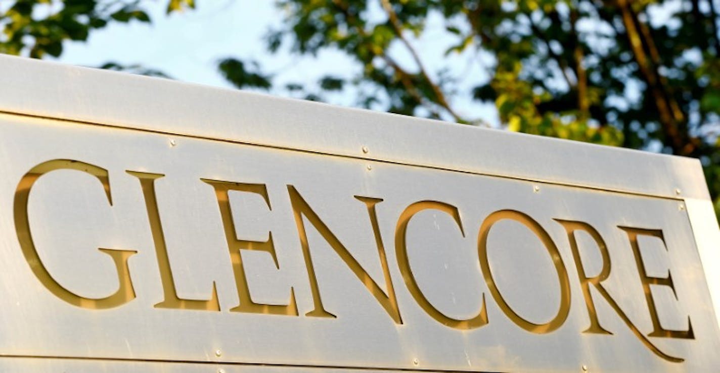 FILE PHOTO: The logo of commodities trader Glencore is pictured in front of the company's headquarters in Baar, Switzerland, July 18, 2017. REUTERS/Arnd Wiegmann/File Photo