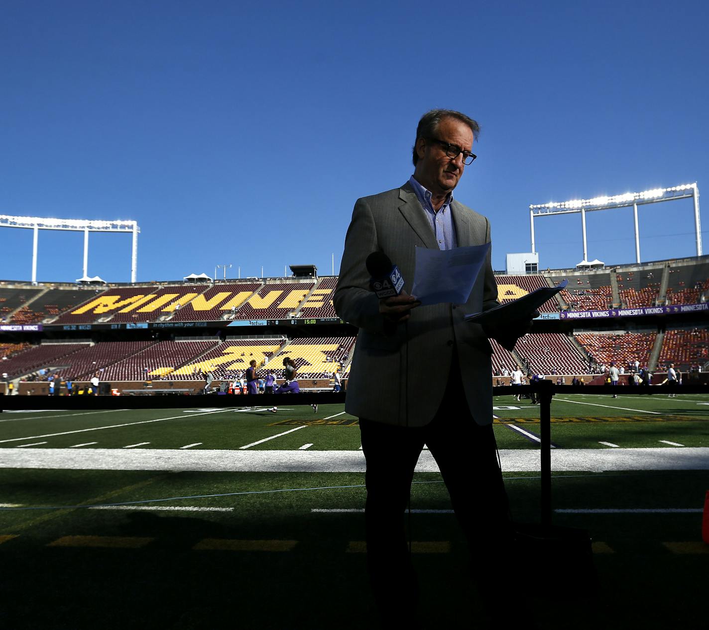 Ever the old schooler in a sport coat, WCCO sports director Mark Rosen prepared for a Vikings pregame broadcast at TCF Bank Stadium.