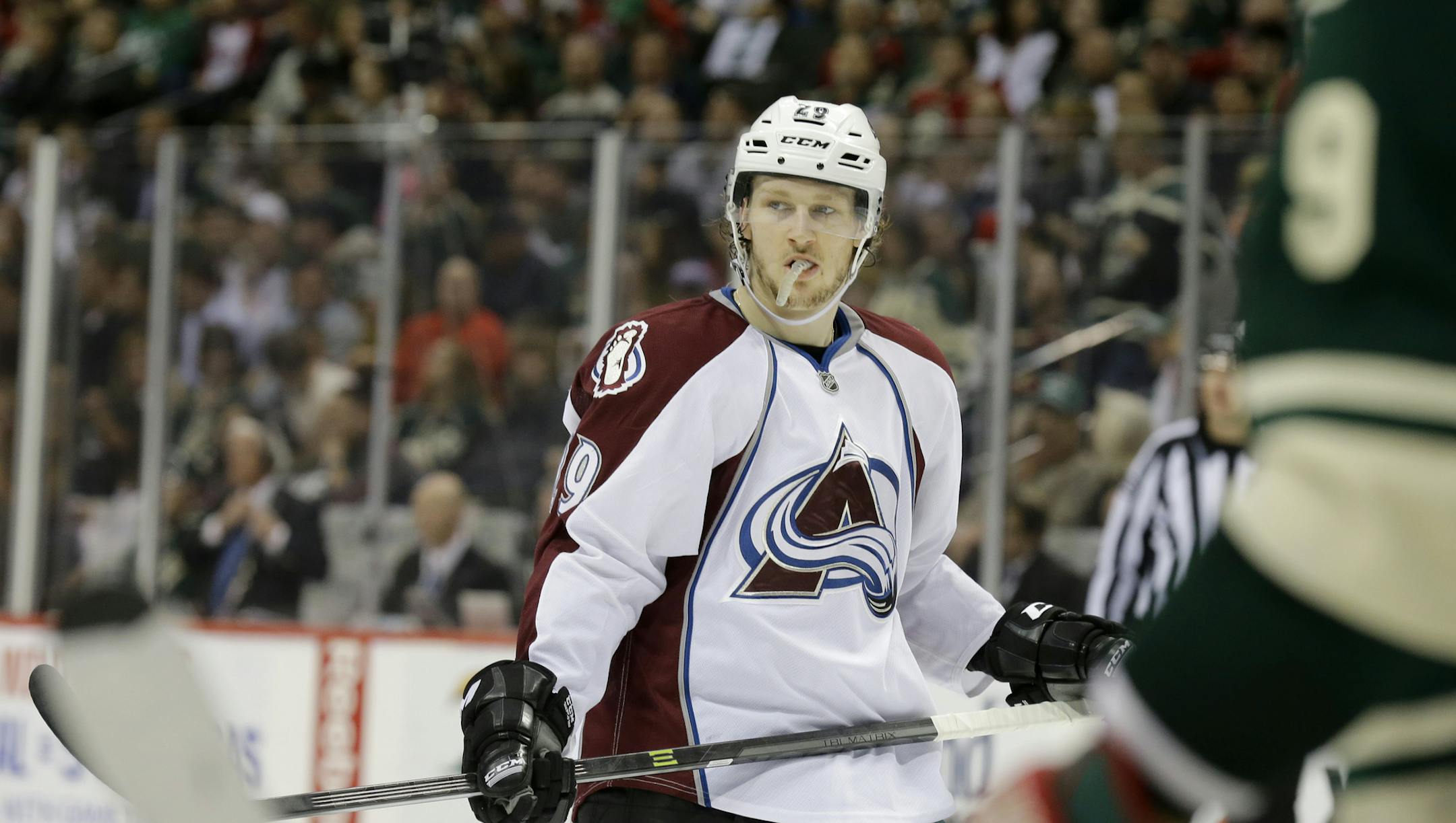 Colorado Avalanche center Nathan MacKinnon (29) gets into position for a face-off during the second period of Game 3 of an NHL hockey first-round playoff series against the Minnesota Wild in St. Paul, Minn., Monday, April 21, 2014. (AP Photo/Ann Heisenfelt)