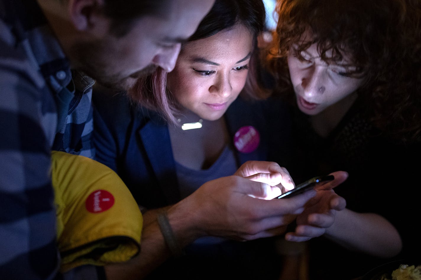 Mitra Jalali Nelson checked results on the trash vote at Black Hart of St. Paul.