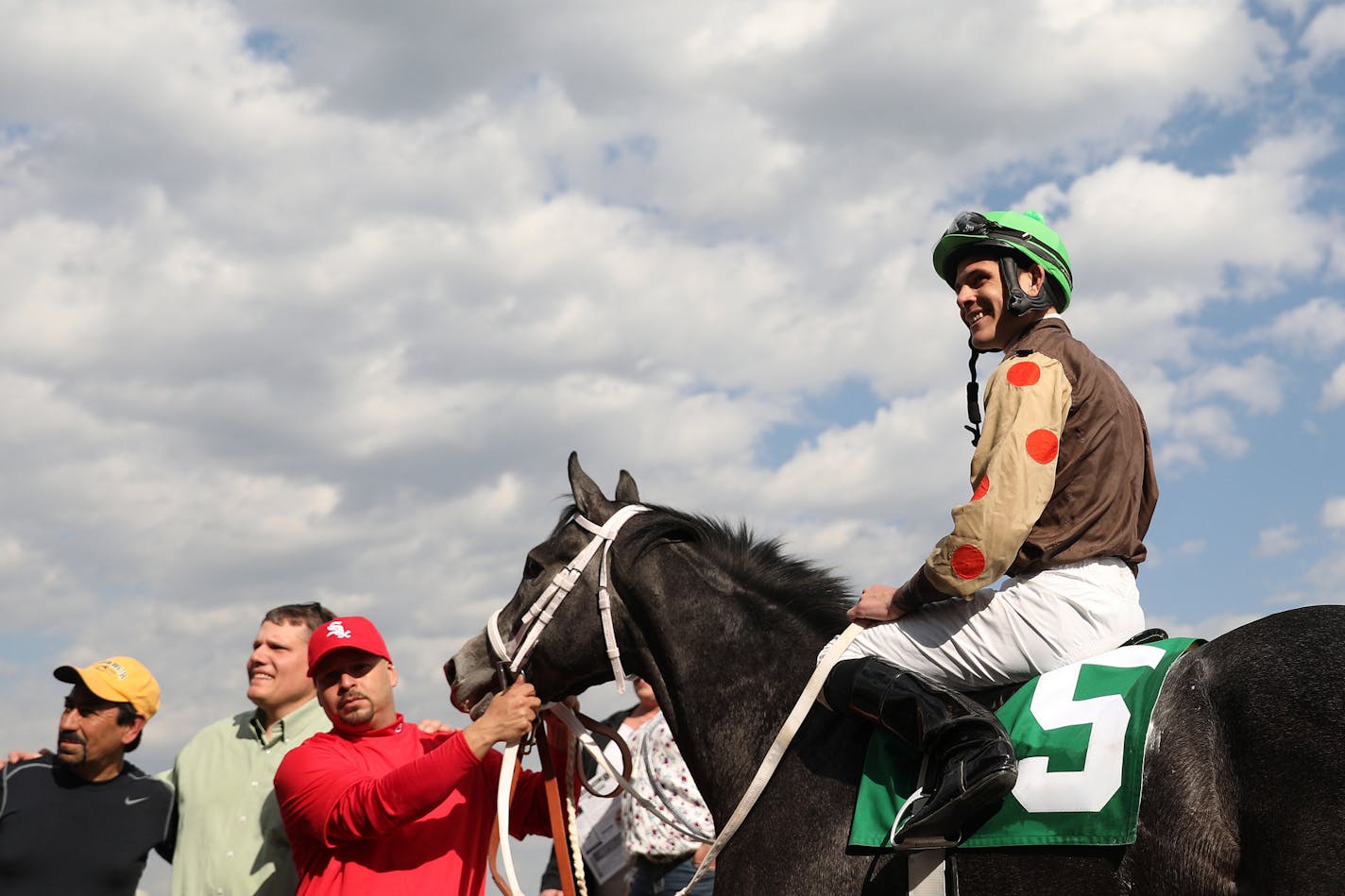 Jockey Denny Velazquez riding Trappingsofsilver (5) smiled in the winner's circle after winning the second race Friday. ] ANTHONY SOUFFLE • anthony.souffle@startribune.com Horses took to the track for the first night of live racing for the season Friday, May 5, 2017 at Canterbury Park in Shakopee, Minn.